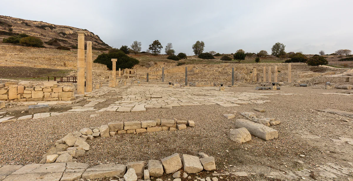 The ruins of Amathus, the ancient city near Limassol, with standing columns and stone blocks spread across the ground