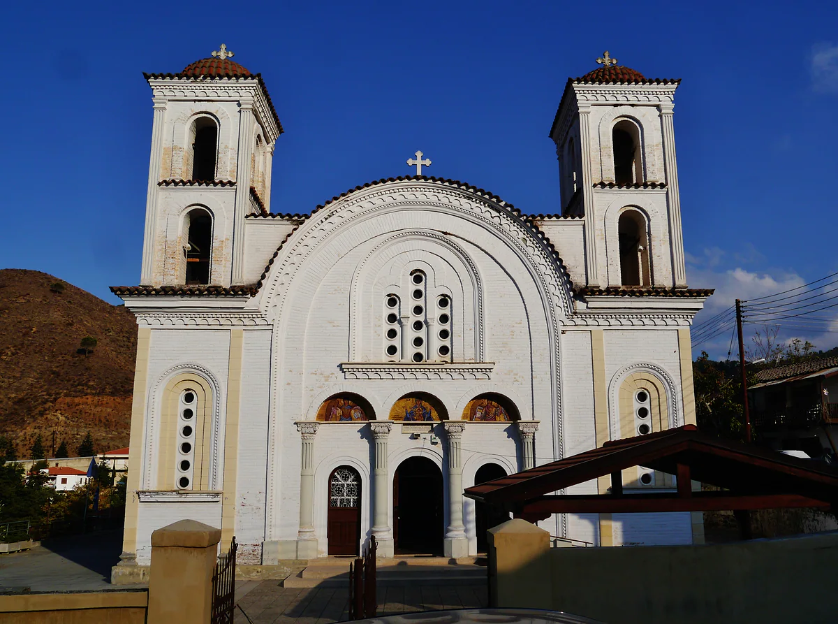 The church of Panagia Odigitria in Galata, white with twin bell towers and a dome, in the Solea valley of the Troodos