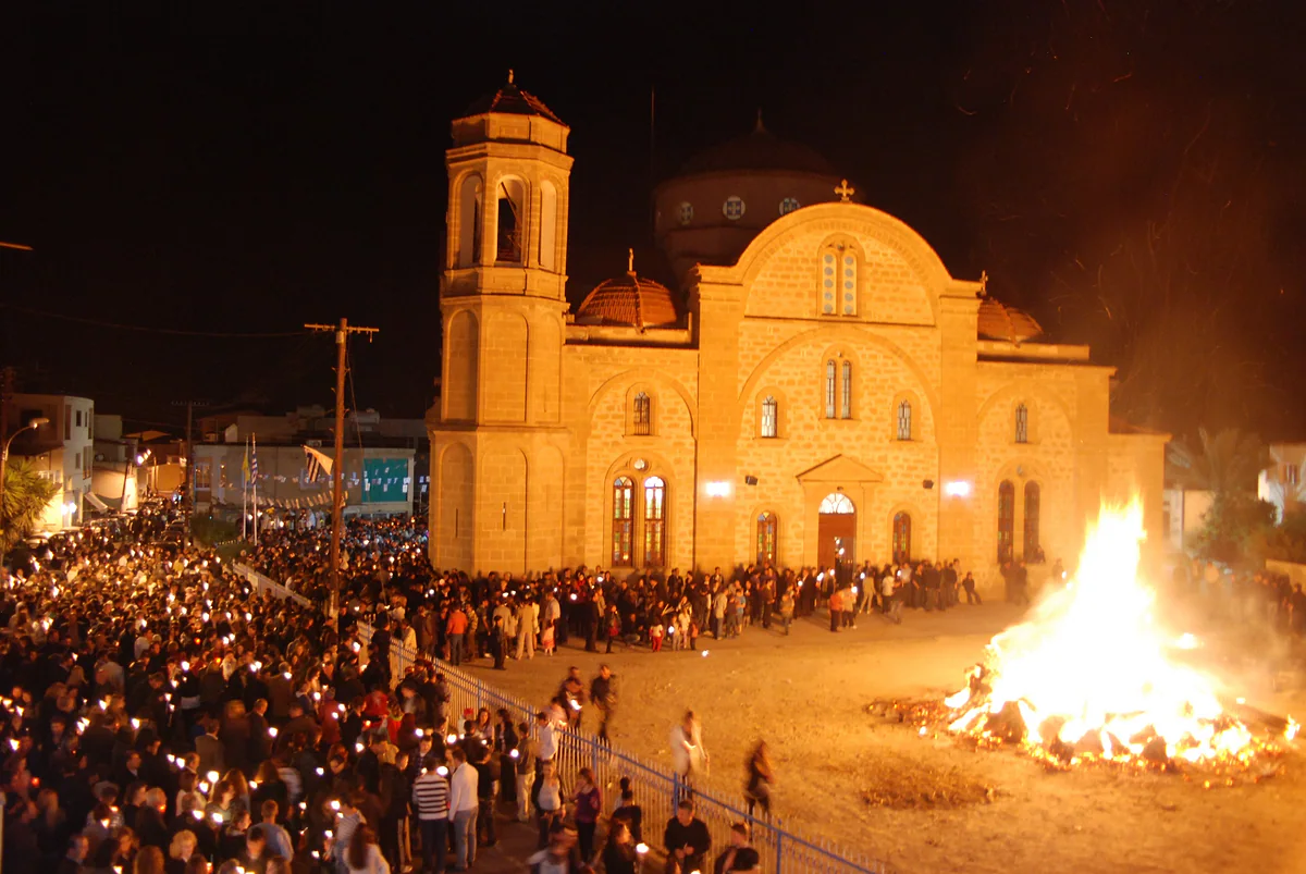The Easter night bonfire outside the church of Panagia Evangelistria in Dali, with villagers gathered round