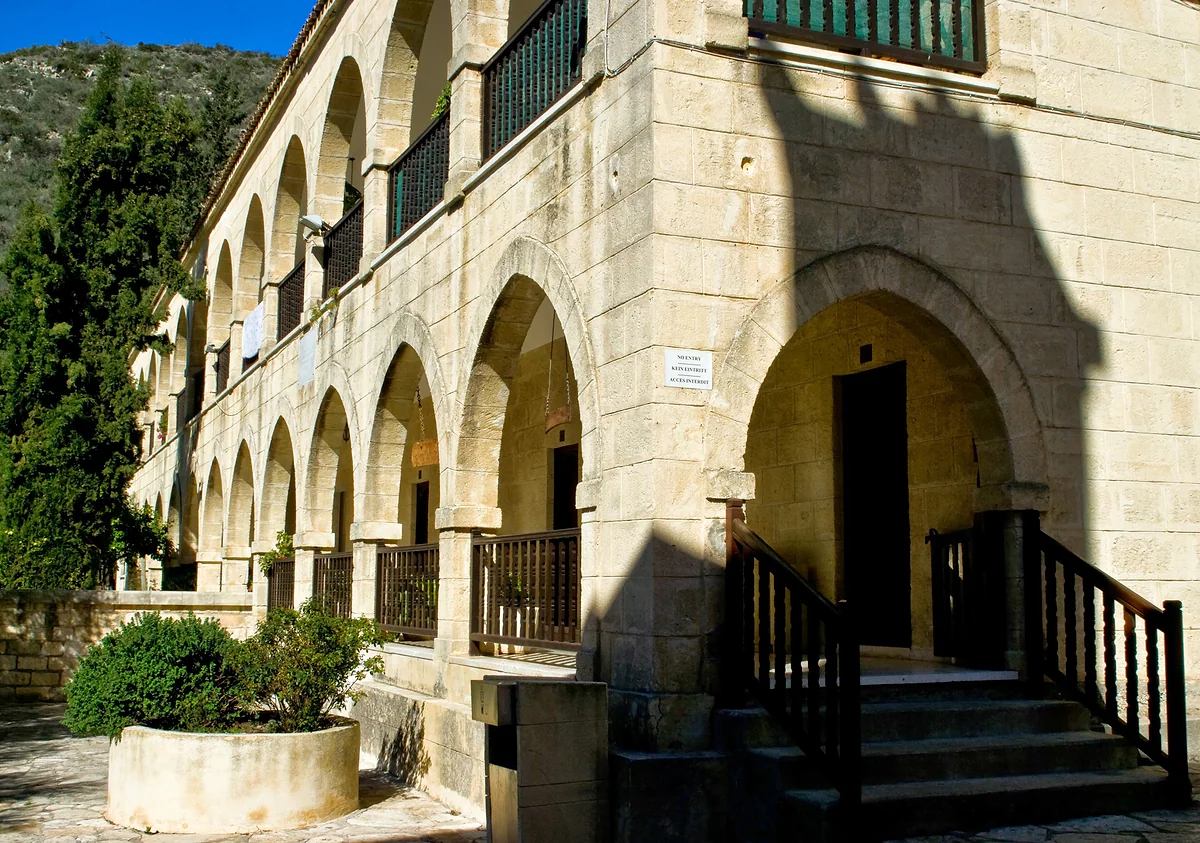 The monastery building of Agios Neophytos near Tala, with two storeys of stone arches, balconies and an entrance staircase