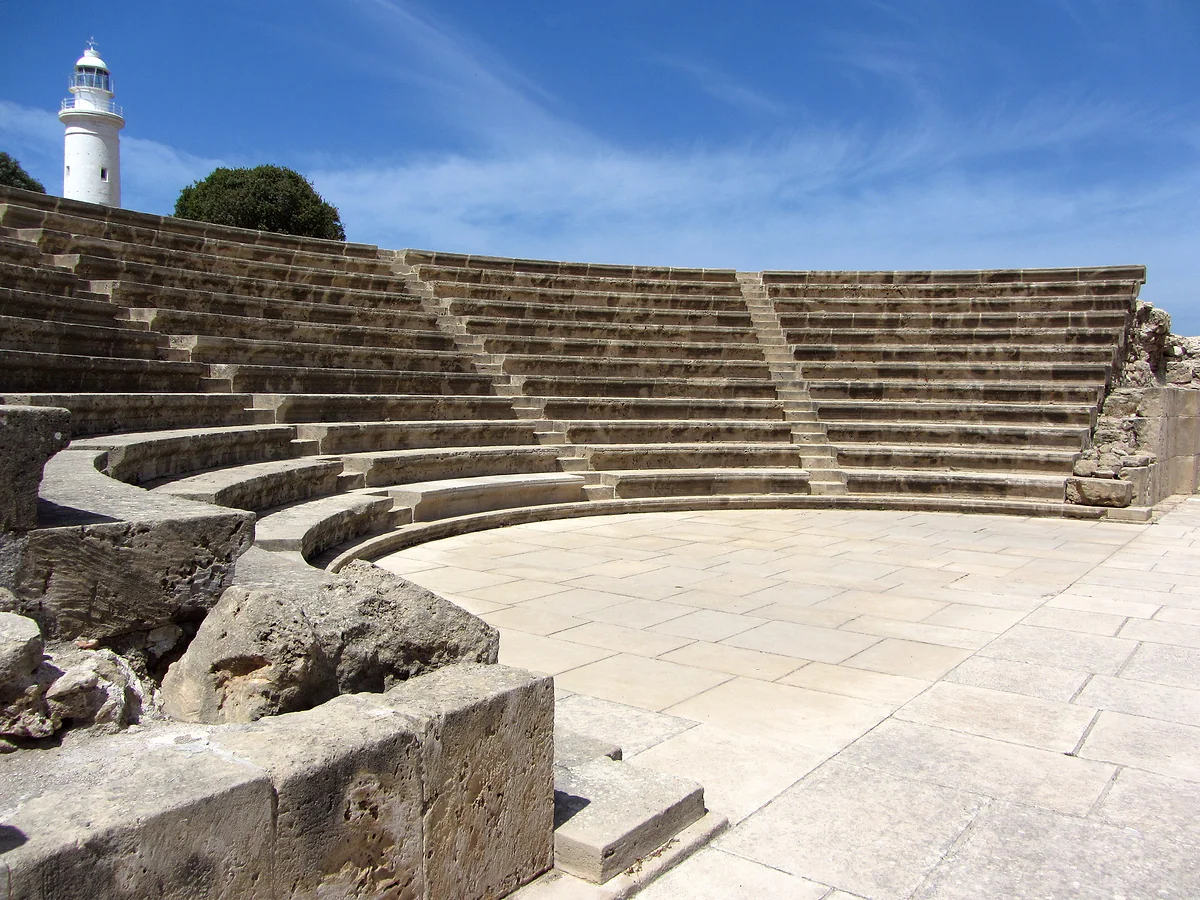 The restored stone odeon and the white lighthouse in the Kato Paphos archaeological park, a World Heritage Site since 1980