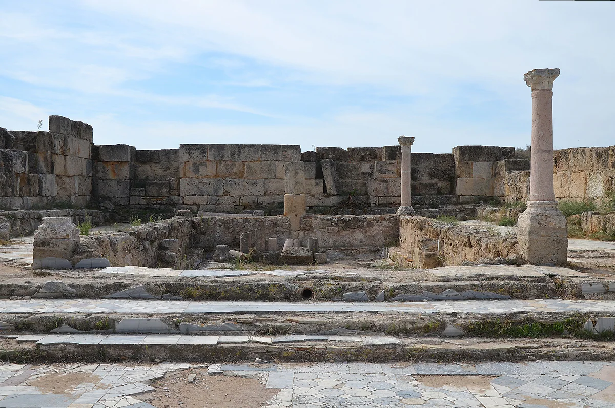 The marble pool at the corner of the gymnasium portico at Salamis, from the 2nd century AD, with columns and stone walls