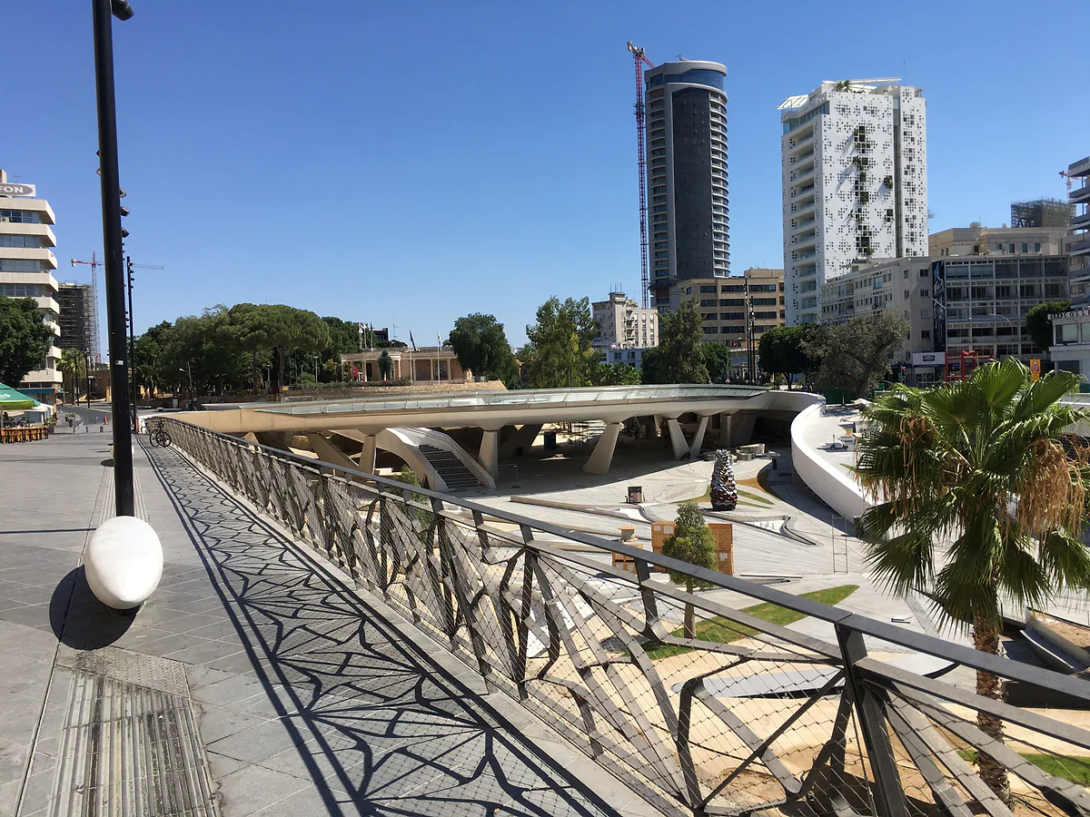 Eleftheria Square in Nicosia spanning the moat of the Venetian walls, with white walkways and modern towers behind