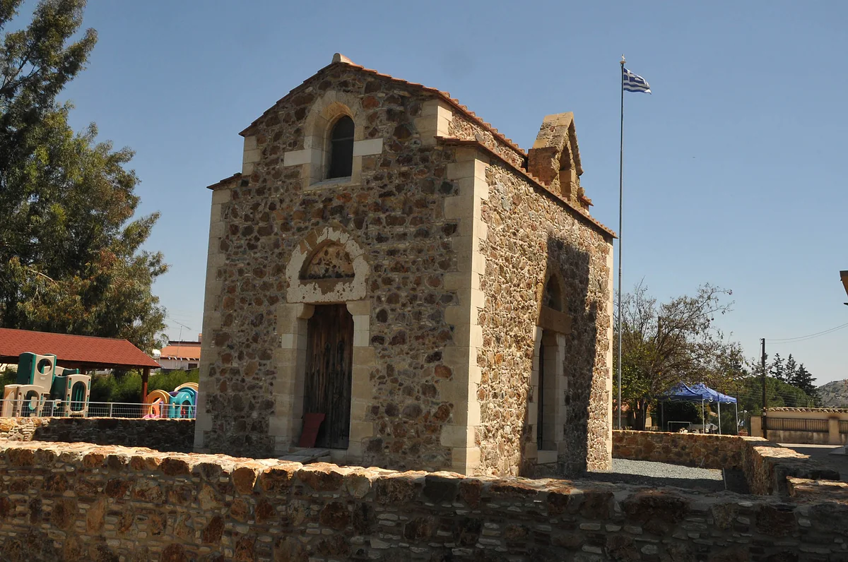 The royal chapel of St Catherine at Pyrga, small and built of stone, with its Gothic doorway and a low wall in front