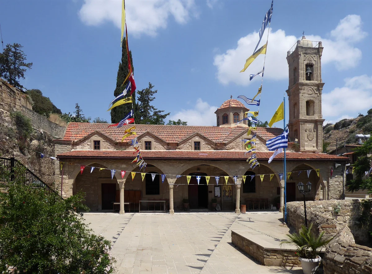The church of Saints Constantine and Helen at Tochni, with an arcaded porch, a bell tower and festive flags