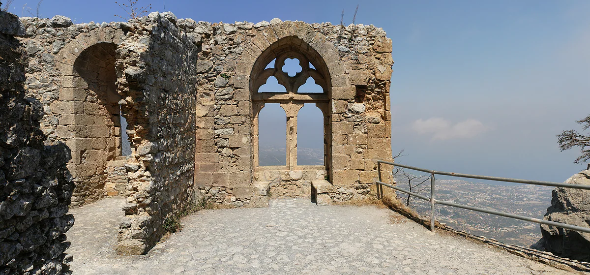 The Gothic Queen's Window in the upper ward of St Hilarion Castle, with the north coast of Cyprus in the distance
