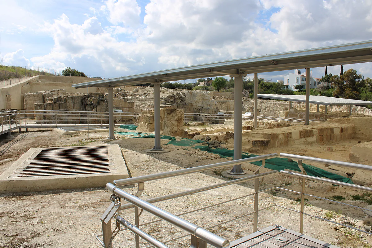 The excavated remains of the palace of ancient Idalion, with stone walls, walkways and a protective shelter
