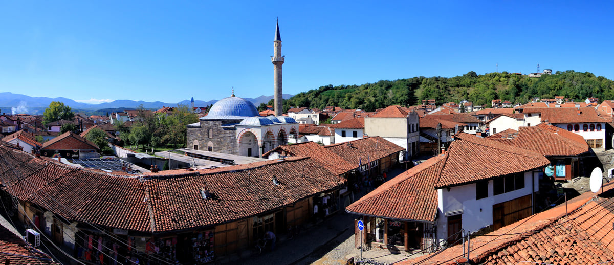 Panorama of the Grand Bazaar of Gjakova with the Hadum Mosque, its blue dome and minaret above the rooftops