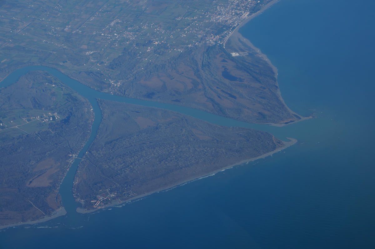 The mouth of the River Bojana and Ada Bojana island from the air, with the river's meanders and the line of the coast